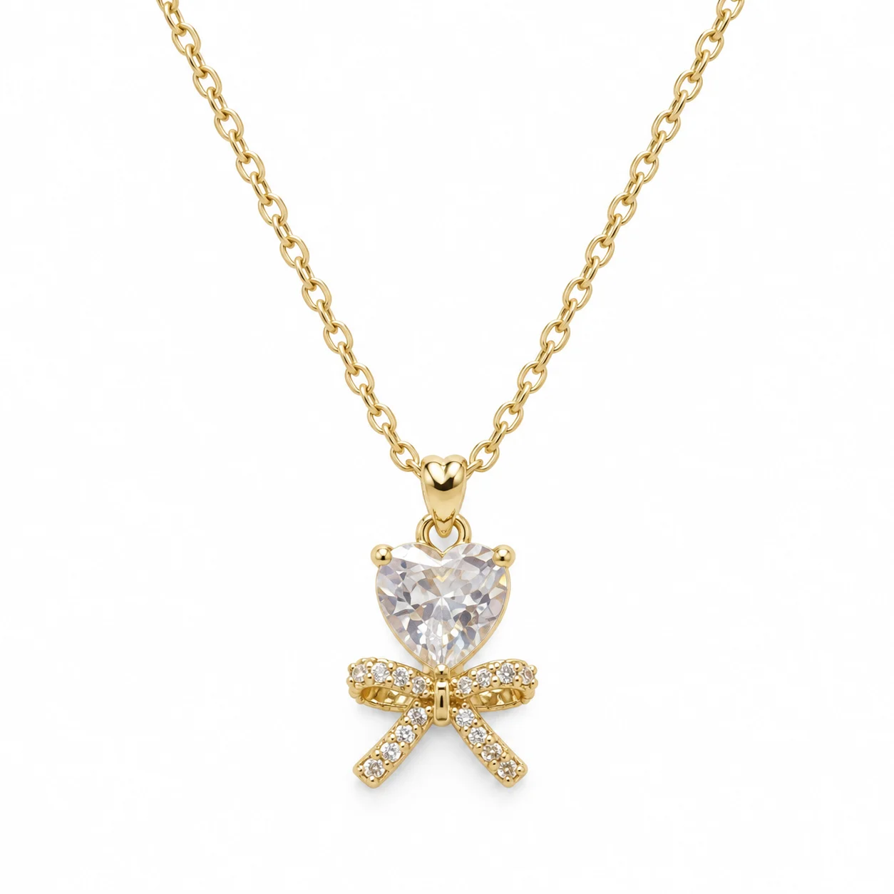 Gold-tone Necklace with Clear Heart-shaped Stone and Bow Pendant