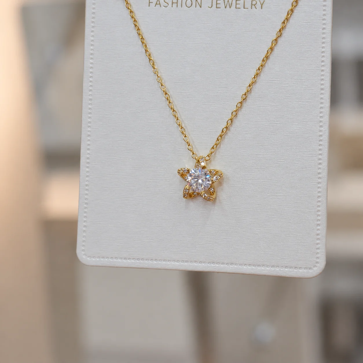 Gold-tone Star Pendant Necklace with Clear Sparkling Accents
