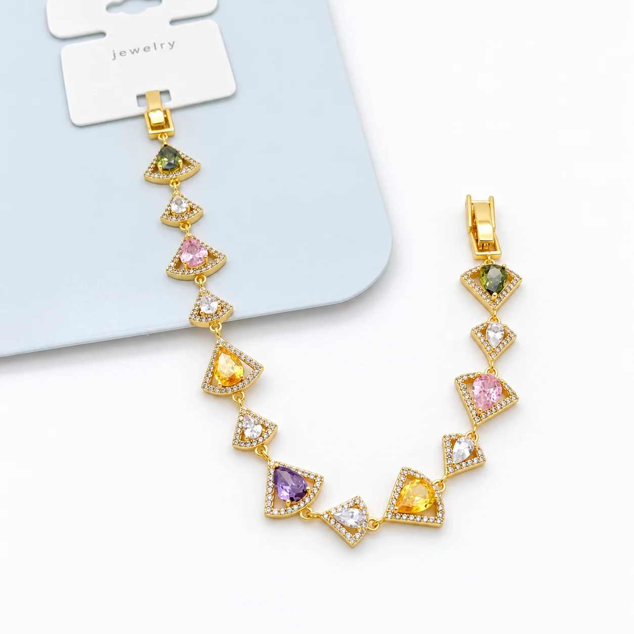 Gold-tone Bracelet with Multicolor Pear-shaped Stones in Openwork Fan Frames